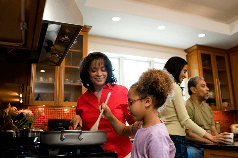 girl cooking with supervision